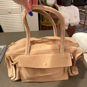 Club Monaco Light Pink real suede purse. Good condition.